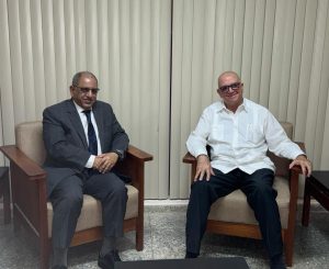 Our ambassador to Cuba discusses ways to strengthen bilateral relations with a Cuban official.