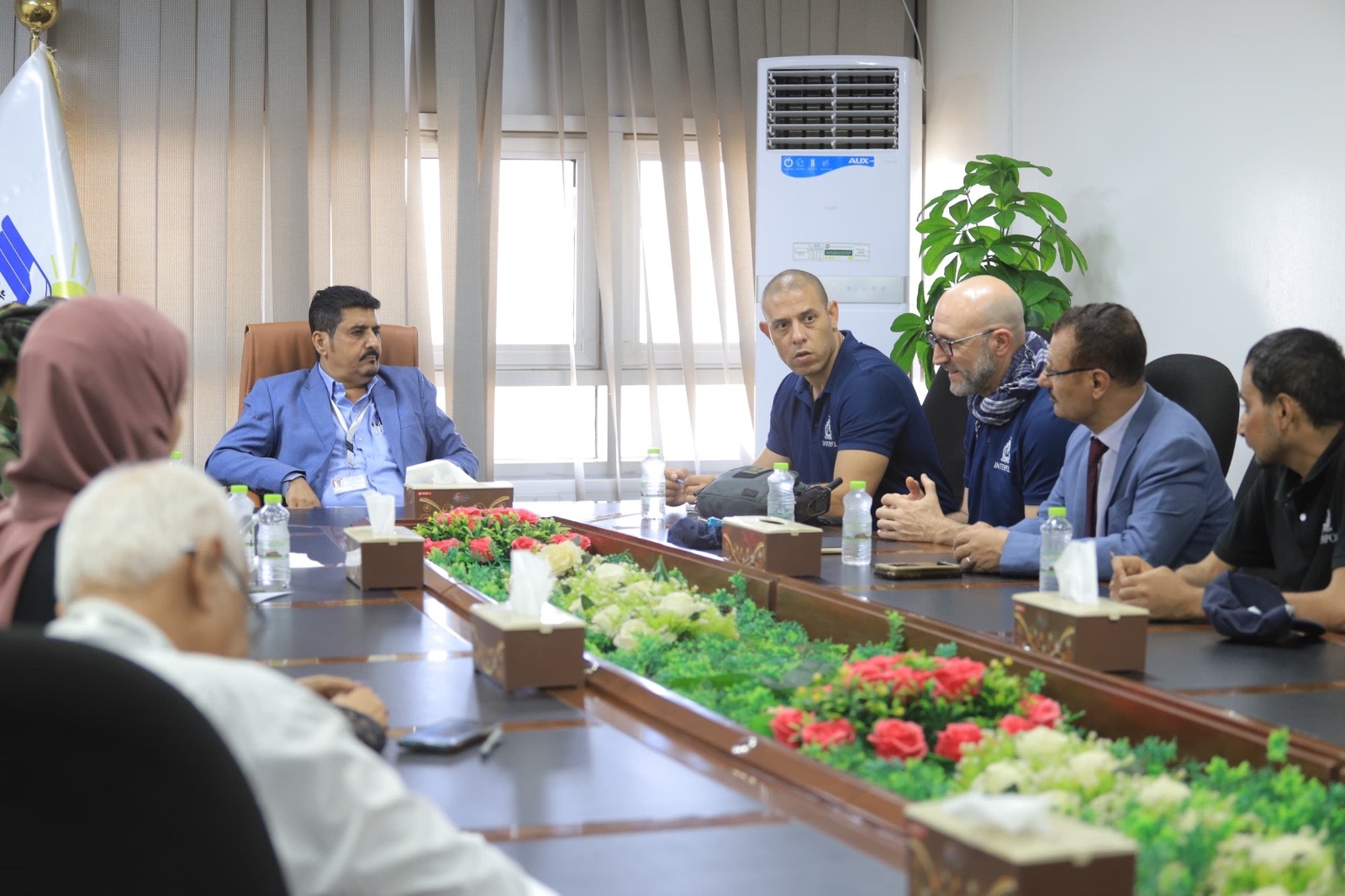 An Interpol delegation discusses joint cooperation with key service facilities in Aden.