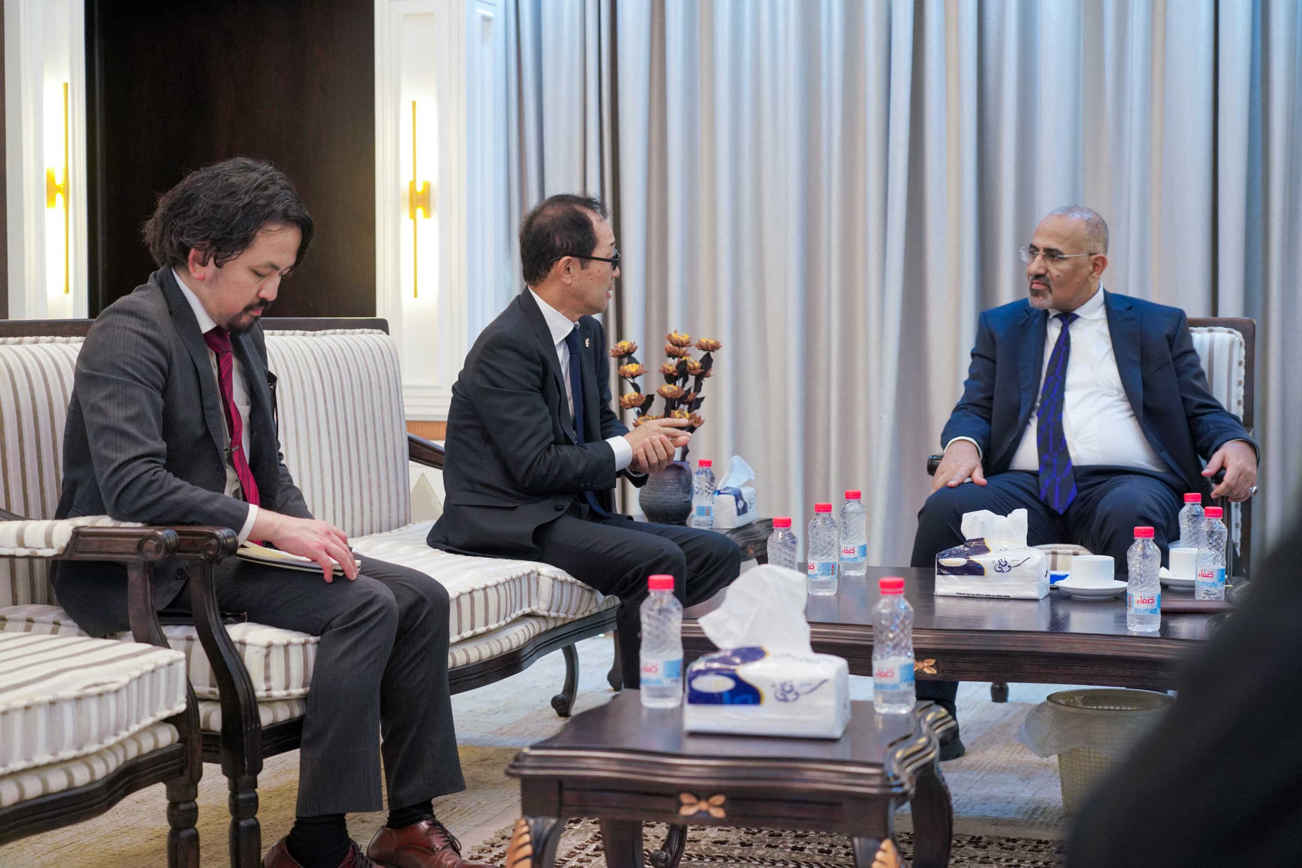Council member Aidarus al-Zubaidi discusses ways to enhance Japan's developmental support for Yemen with the Japanese ambassador.