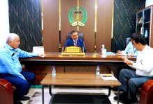 The Minister of State and Governor of Aden reviews operations at the container port.