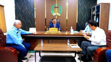 The Minister of State and Governor of Aden reviews operations at the container port.